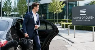 Executive passenger arriving at Farnborough Business Park for a business meeting
