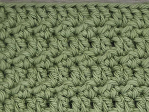 Close-up of yarn worked in the Floret Stitch with a raised, all over texture