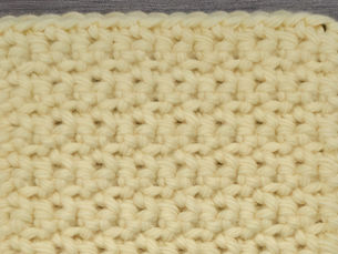 Close-up of yarn worked in Alternative Single Crochet by alternating between the front and back loops.