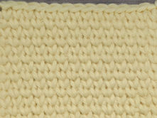Close-up of yarn worked in the dense, knit-like Waistcoat Stitch.