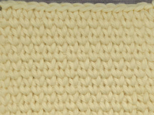 Close-up of yarn worked in the dense, knit-like Waistcoat Stitch.