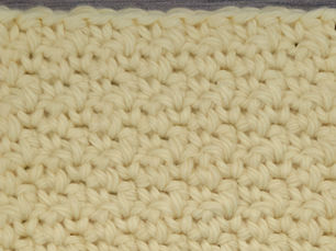 Close-up of yarn worked in the Lemon Peel Stitch with alternating Single Crochet and Double Crochet stitches.