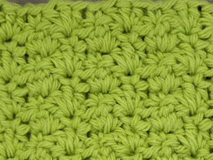 Close-up of yarn worked in the Double Crochet Trio Stitch with grouped Half Double Crochet and Double Crochet stitches.