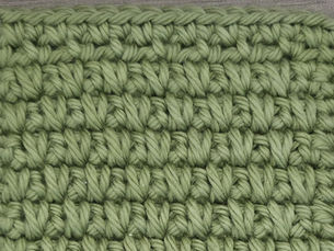 Close-up of yarn worked in the Double Moss Stitch with alternating Single Crochet and spike stitch rows