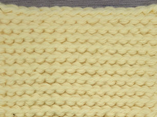 Close-up of yellow yarn worked in rows of Slip Stitch