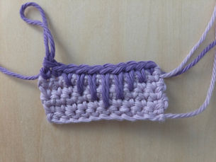 Lavender crochet swatch showing Spike Stitches worked into progressively lower rows.
