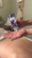 Deep Blue Rub being used for pain relief during a massage