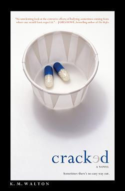 The book cover for Cracked by K.M. Walton that has two blue and white capsules in a paper hospital cup.