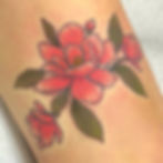 Pink magnolia flower tattoo