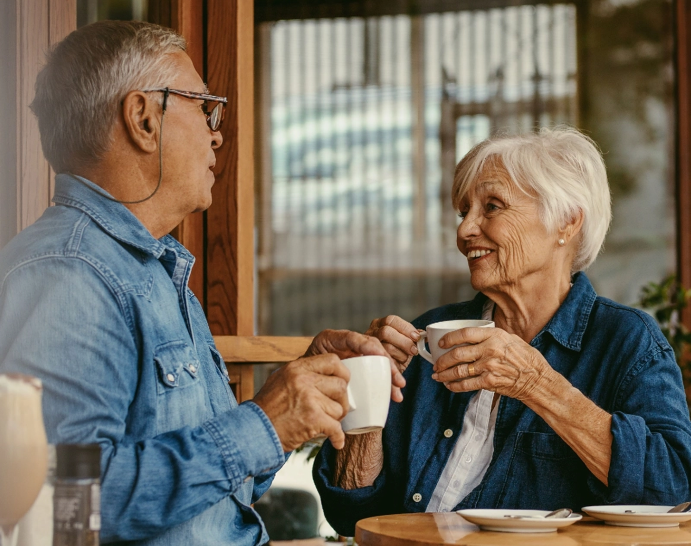 Two seniors doing a session over coffee