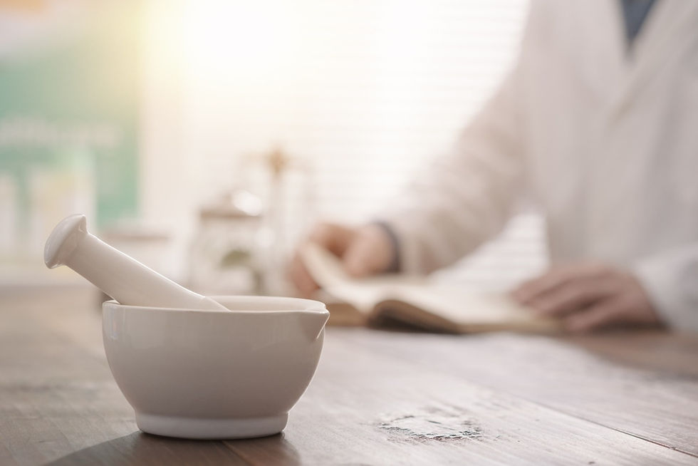Professional pharmacist grinding a medical preparation using a mortar and pestle, pharmacy