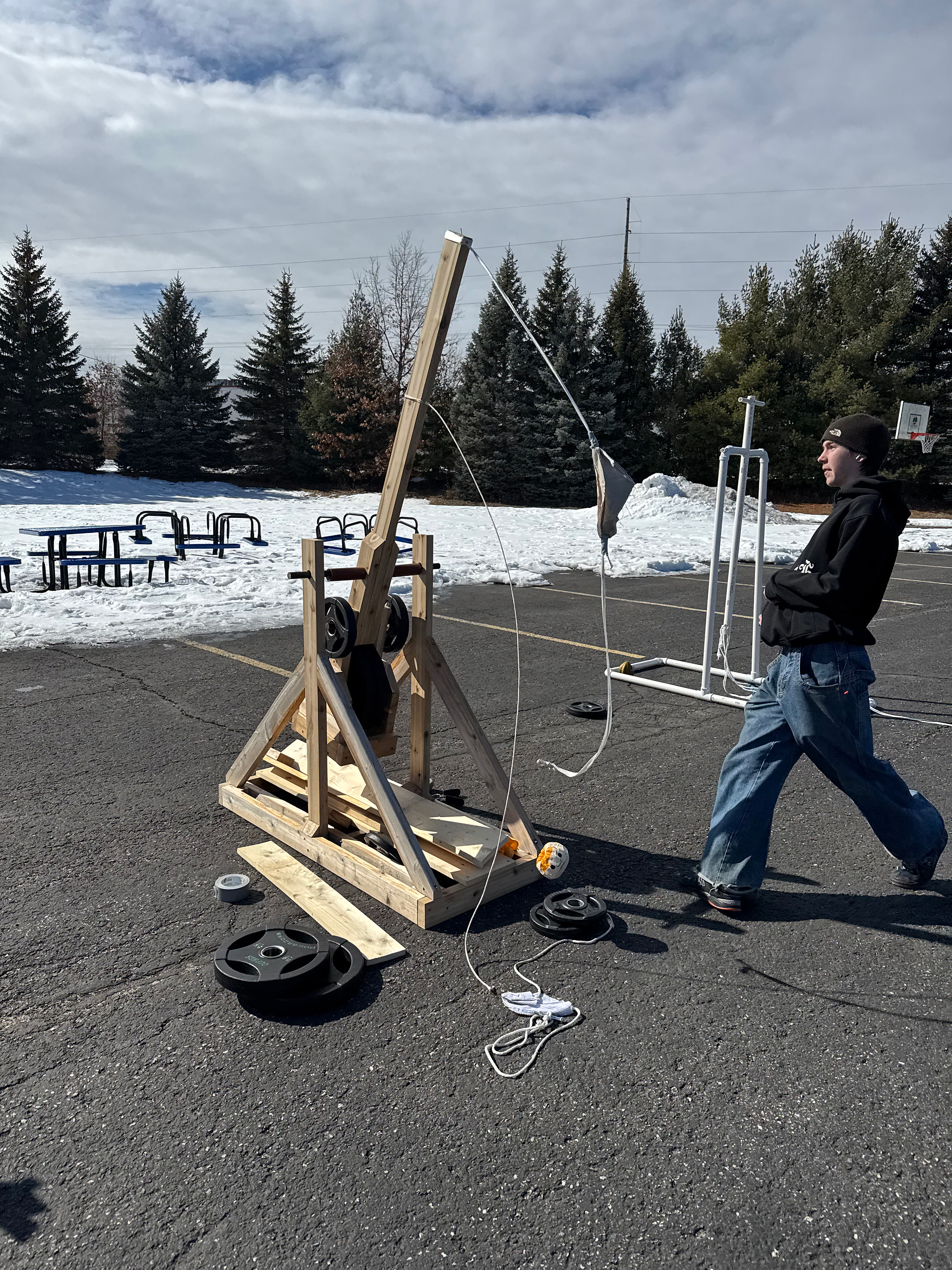 11th graders testing their trebuchets for physics class