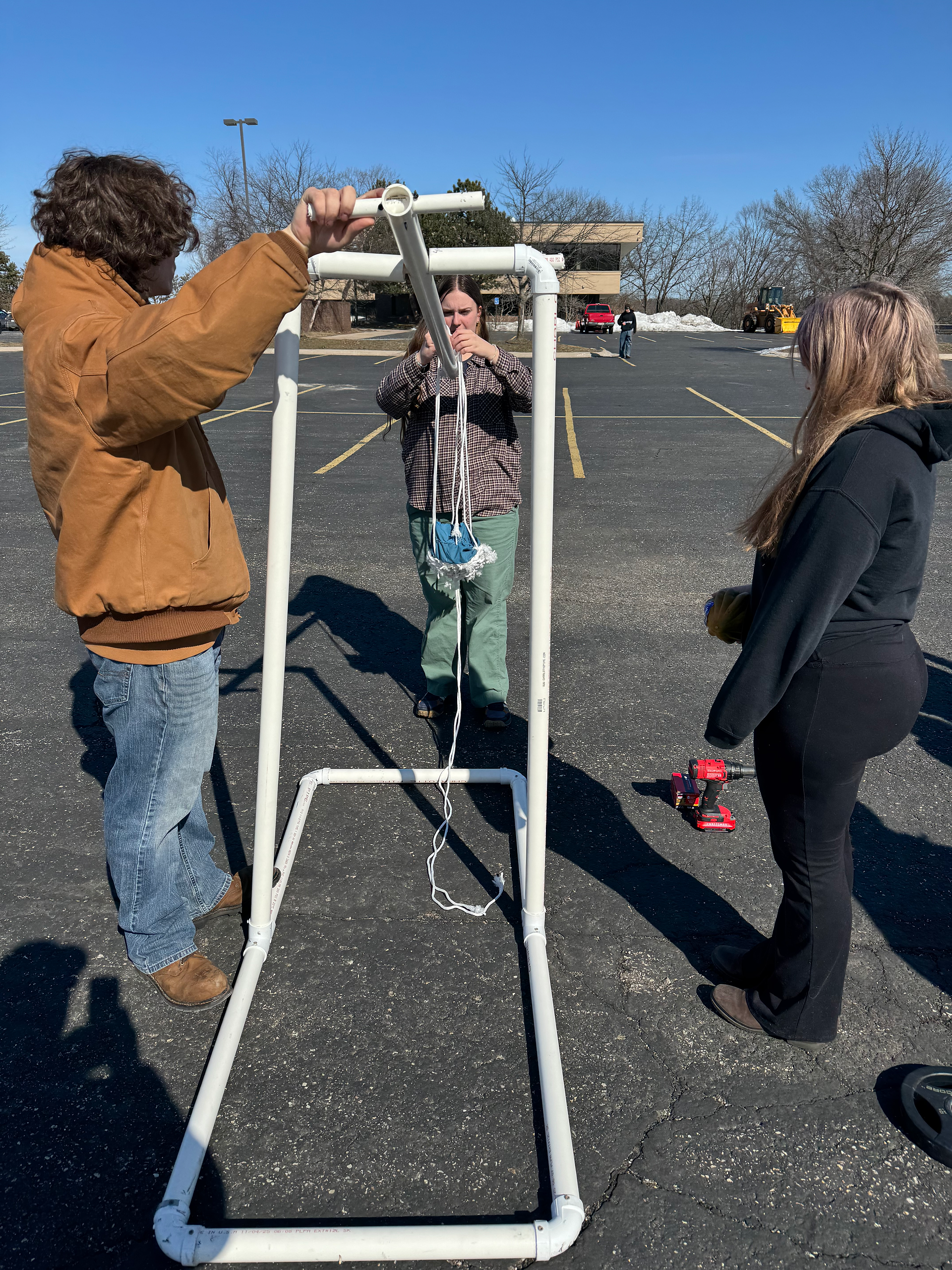 11th graders testing their trebuchets for physics class