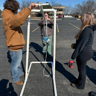 11th graders testing their trebuchets for physics class