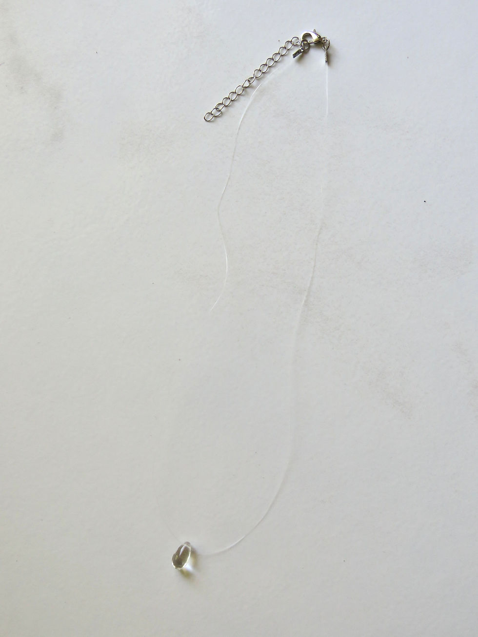 Clear raindrop pendant on clear chain