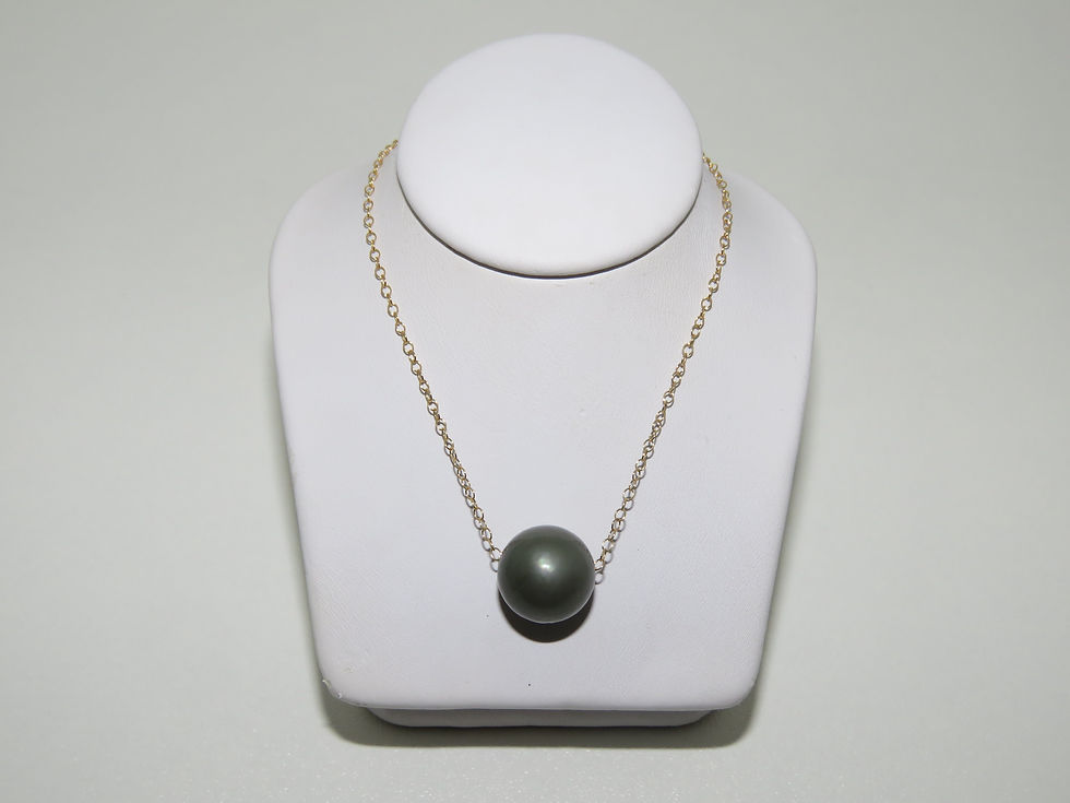 Gold chain Tahitian pearl necklace on white display on white background