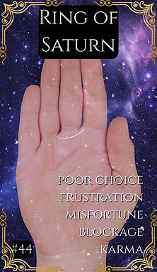 "Hand showing ring around Saturn finger against starry purple backdrop"