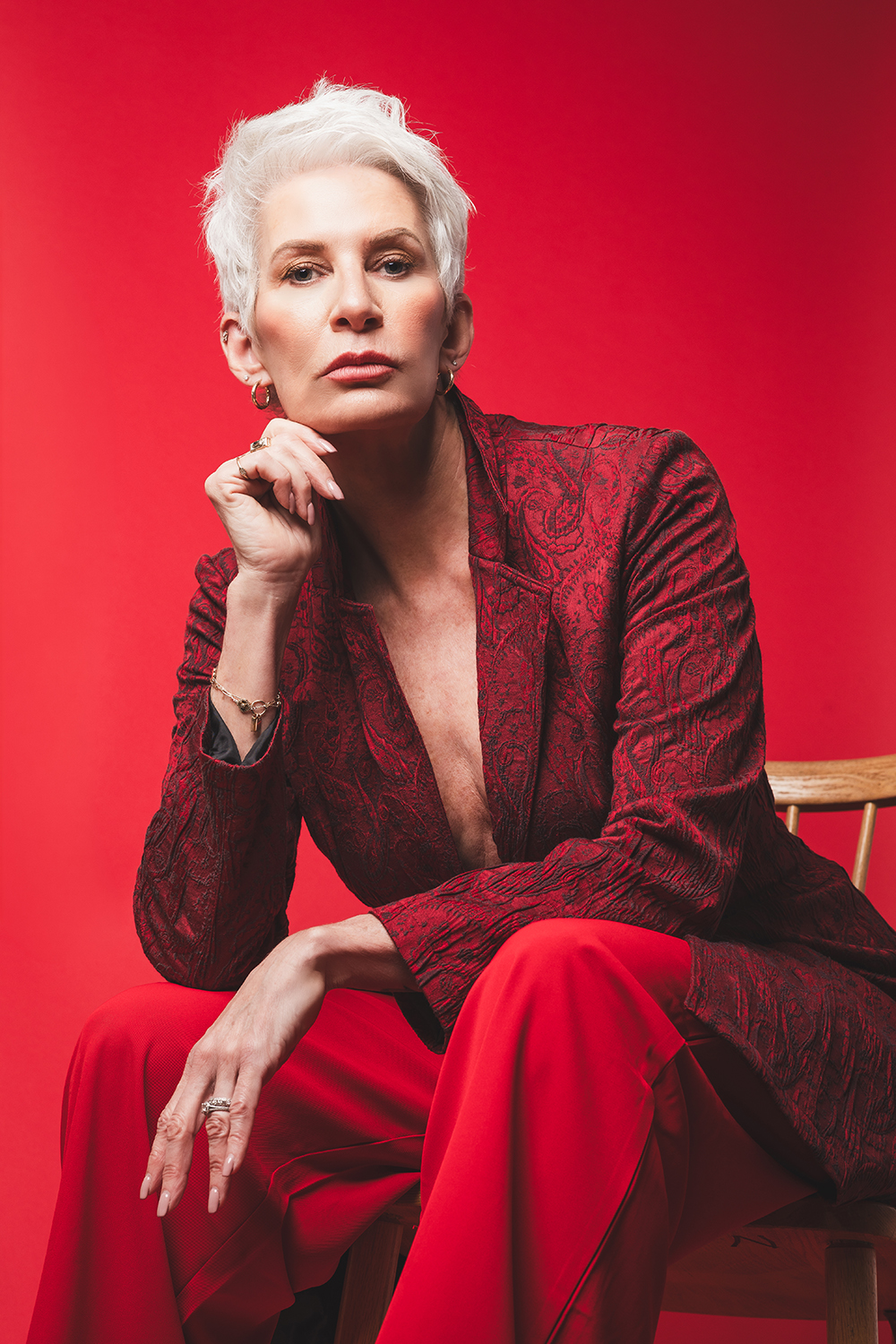 older woman in red clothes sitting on chair