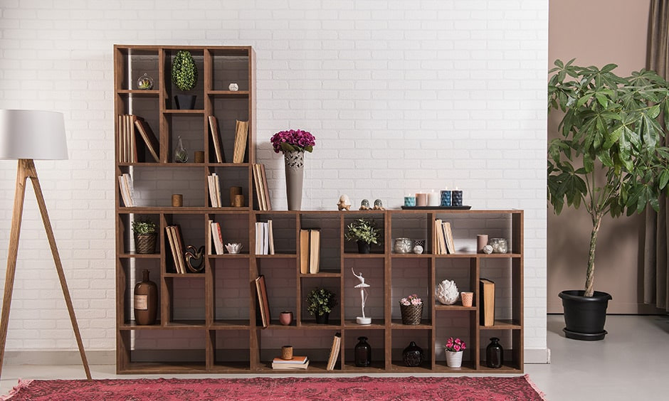 The best way to breathe a little life into any space is by placing some plants or flowers. Indoor plants have a stack of health benefits, too, such as improving air quality and even reducing blood pressure. From pitchers to bowls to baskets, there is a wide range of stylish and affordable pots in which you can place your plants. The different shapes and sizes also allow you to add more dimension to your shelf styling. If you don’t have a green thumb, you can go for faux plants. A few examples that look great whether real or artificial: Fan Palm Tree Spider Plants Snake Plant Monstera Leaf