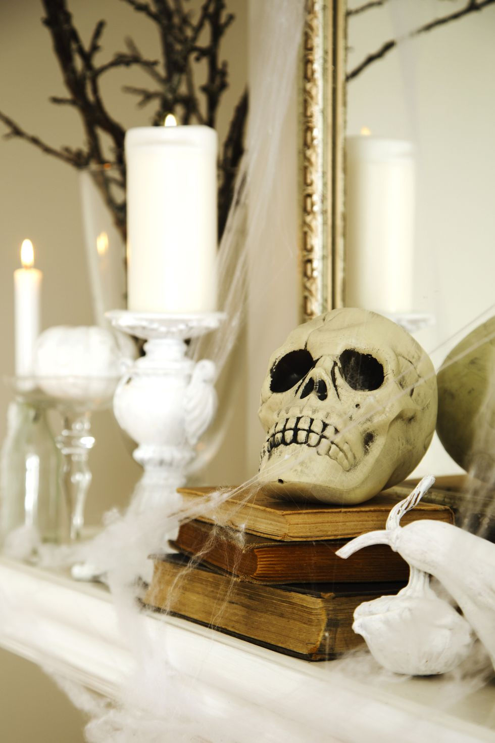 Strategically place skulls and fake spider webs to spruce up your mantlepiece