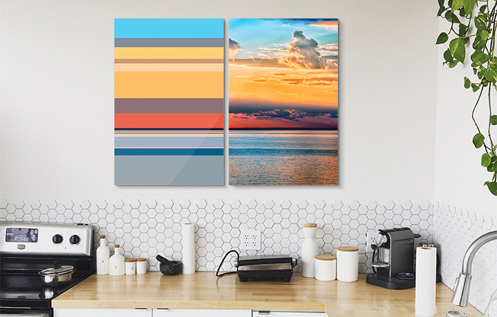 A super easy, inexpensive, and quick-to-change way of adding bold colours to your kitchen is through wall art. Pick large, statement pieces for bare kitchen walls. Whether these feature your favourite spices or merely a handful of cute lemons, wall art instantly jazzes up kitchens. Be sure to put together the right composition for your pieces to make the most of them. You can learn about the best gallery wall compositions here.