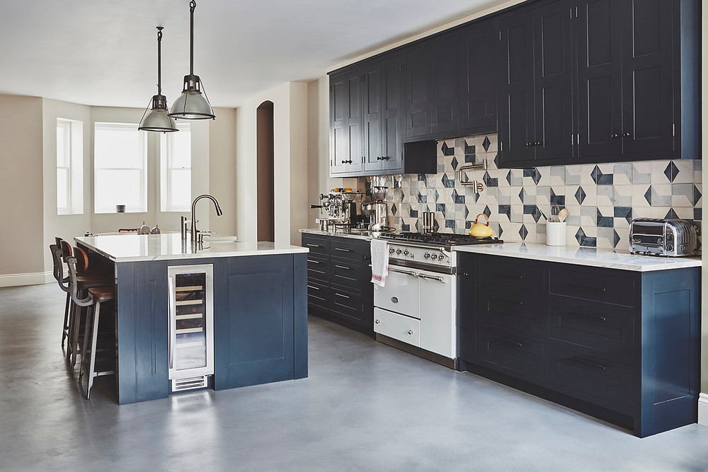 Bold-coloured kitchens aren’t just about adding colour to every nook and cranny. You can experiment by adding just a splash of colour, too. One fantastic way to do so is by using only coloured cabinetry, keeping everything else relatively neutral. You can pair it with a patterned backsplash to ensure your kitchen still makes a statement — even with just a little colour added.