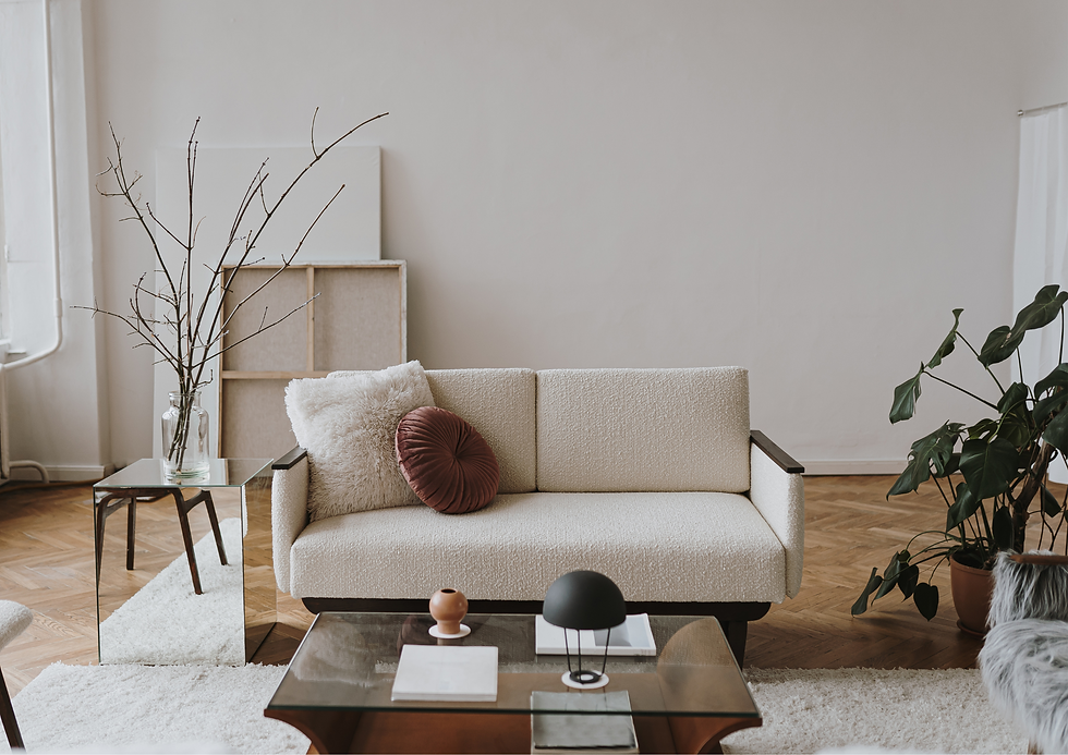 Since the room does not receive much light, choose low furniture pieces with light colours to avoid cramping it further. Also, focus on adding accessories, such as mirrors, that can enhance the amount of light available.