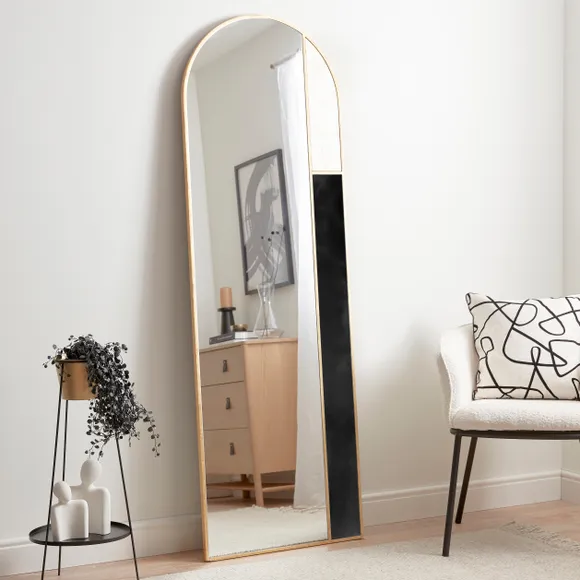 Mirrors — with their reflective properties — make a space look larger. When placed vertically, they can also make a space feel taller. Similarly, windows extending from the floor to the ceiling are widely incorporated in modern designs since they can easily trick the eye into viewing the ceiling as high. They can work with a wide range of ceilings, from flat to pitched, and can connect you to the outdoors, taking away the cramped feeling of a small space.