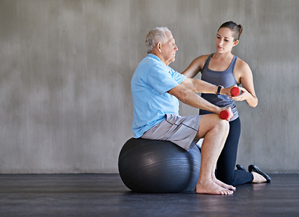 Older man performing physical therapy
