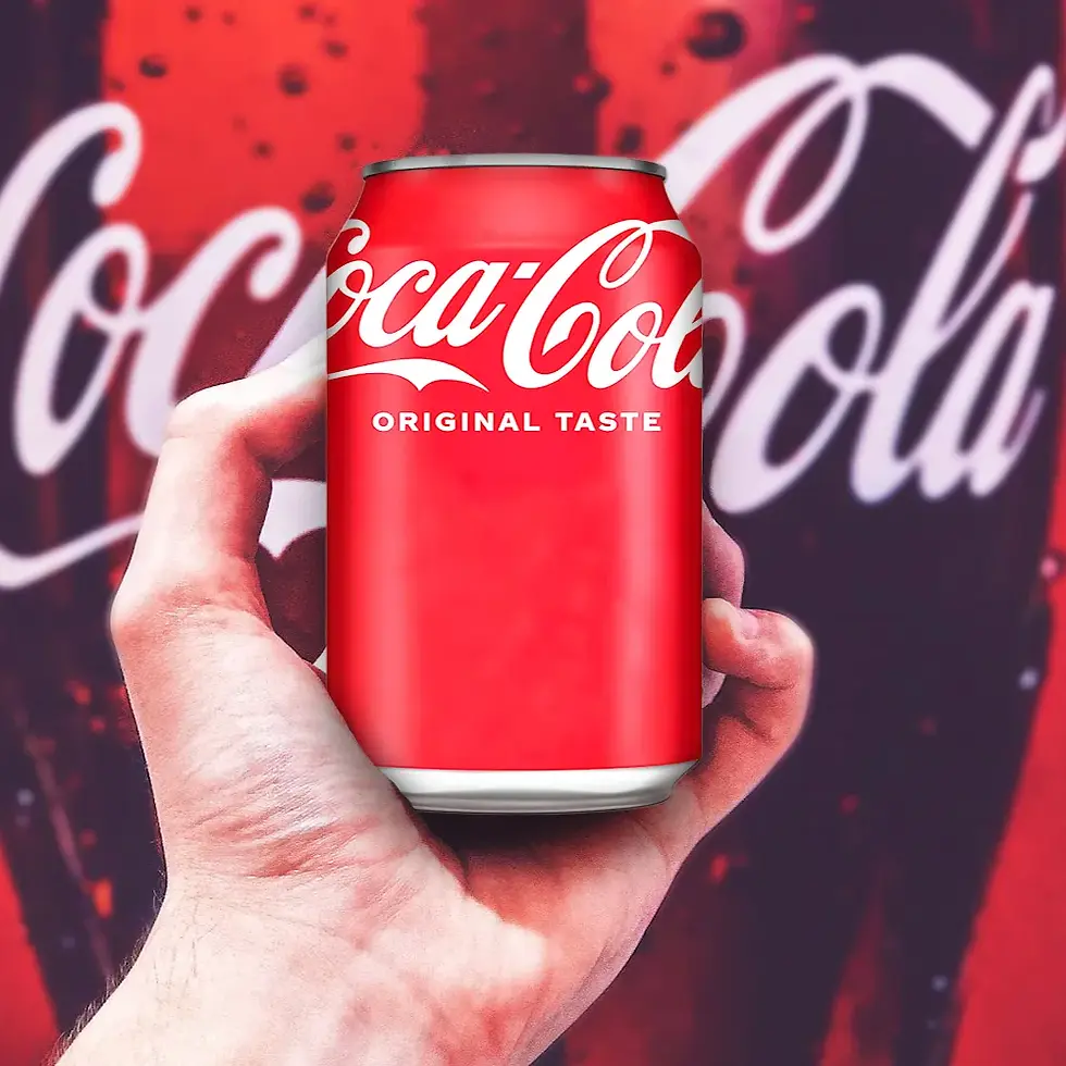 A Person Holding a Coca-Cola Original Taste x 330ml Can
