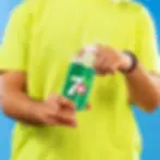 A Guy Opening a 7UP x 330ml Can