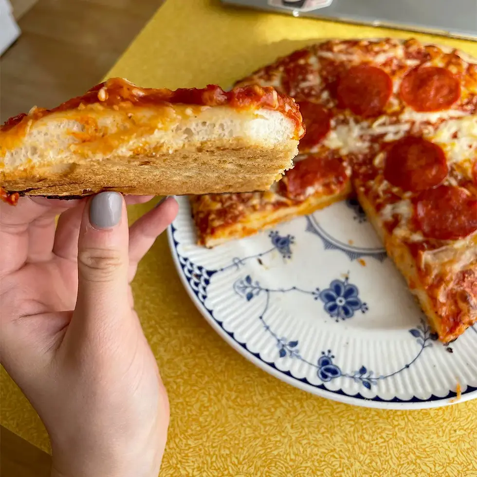 Thumbnail: A Person Holds a Slice of San Marco Pepperoni Frozen Pizza