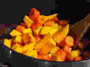 Sear chopped pumpkin and carrots with olive oil