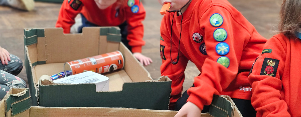 Squirrel Scouts use junk modelling items to create marble runs