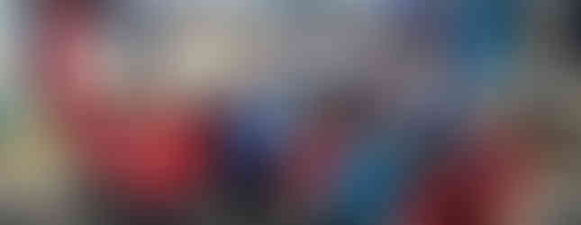 Squirrel and Beaver Scouts and their leaders pose with their group's flags