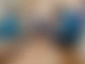 Four Beavers sit in a circle. One has a snake puppet on his hand with the rest of the snake's body next to him. Opposite, the other three Beavers look at a dice in the centre of their group