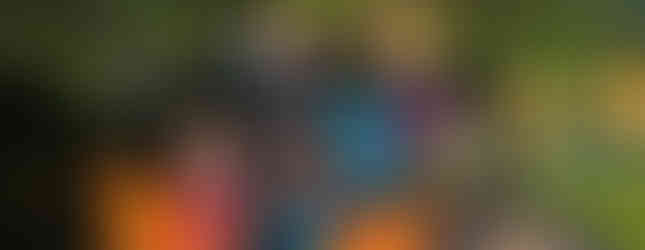 Five Beaver Scouts and a Squirrel Scout sit inside a jeep style vehicle with no wheels