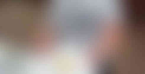 A Scout shows off the tiny pancake they cooked with a tealight under an upturned tin can