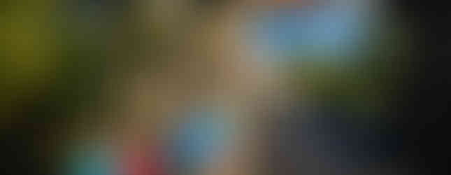 Five Beaver Scouts and a Squirrel Scout stand beneath a theme park sign saying Lost Kingdom