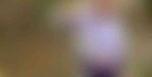 A Beaver Scout poses with her freshly baked bread twist