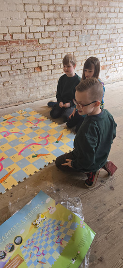 Cubs play an Easter version of Snakes and Ladders