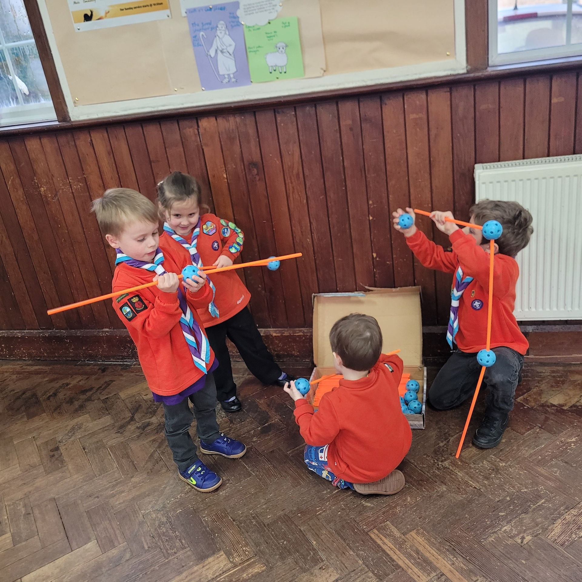 Squirrel Scouts use poles and waffle balls to build structures