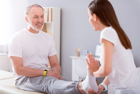 physician examing a patients foot