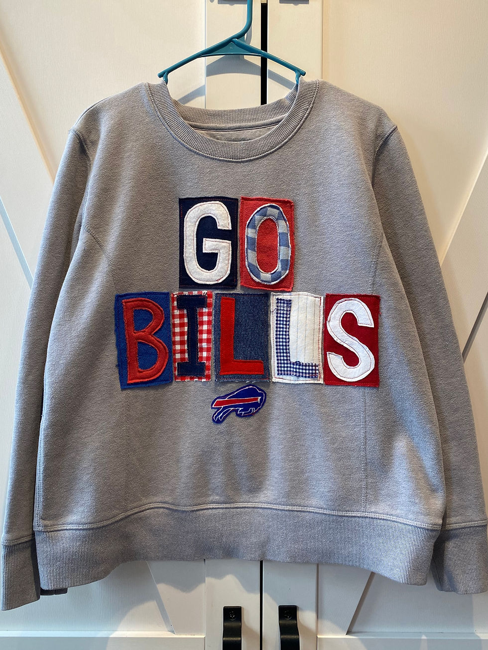 Thumbnail: Grey crewneck with "Go Bills" made from mismatched red, white, blue fabrics and small bills logo