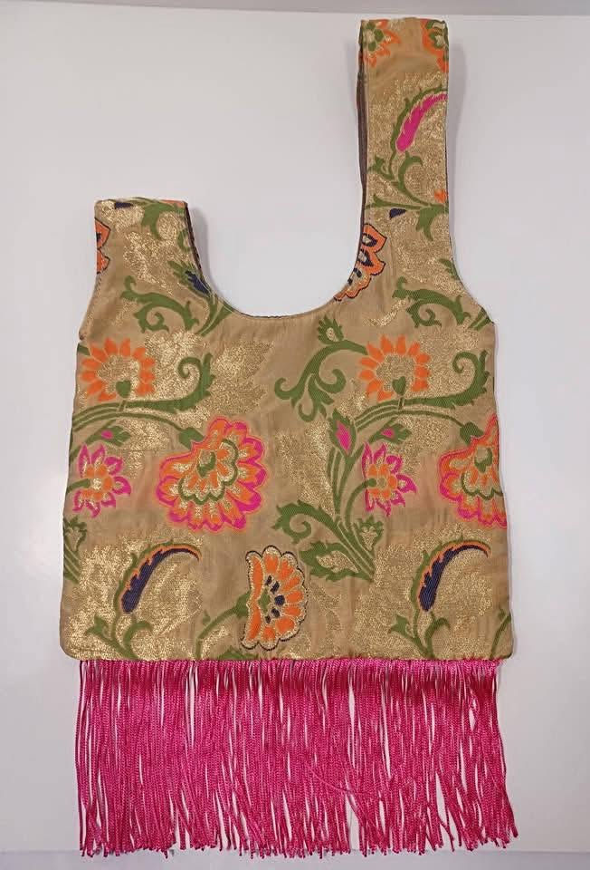 Thumbnail: Elevated Gold Brocade Knot Bag | Handmade Floral Bag with Hot Pink Fringe