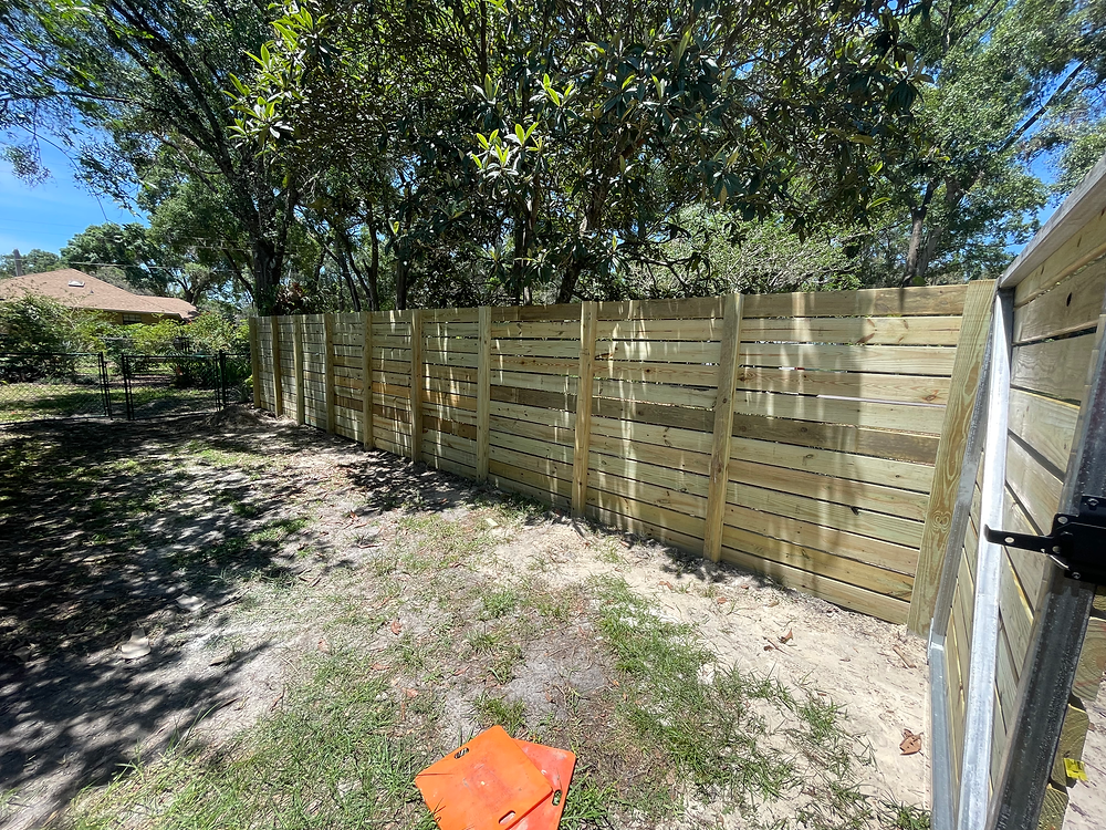 Newly installed wooden privacy fence