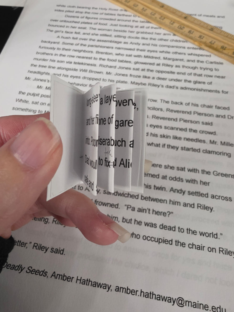 Book with glued-in pages. Glue the first "page" to the front cover, add some glue to the spine to glue down all the pages, and then glue the last "page" to the back cover. 