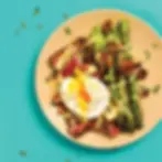 Overhead shot of breakfast food, with Pre steak and asparagus.