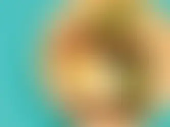 A plate of asparagus and steak with a soft boiled egg on top