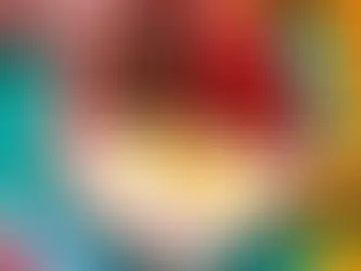 A pink plate with sausage and eggs and strawberries.